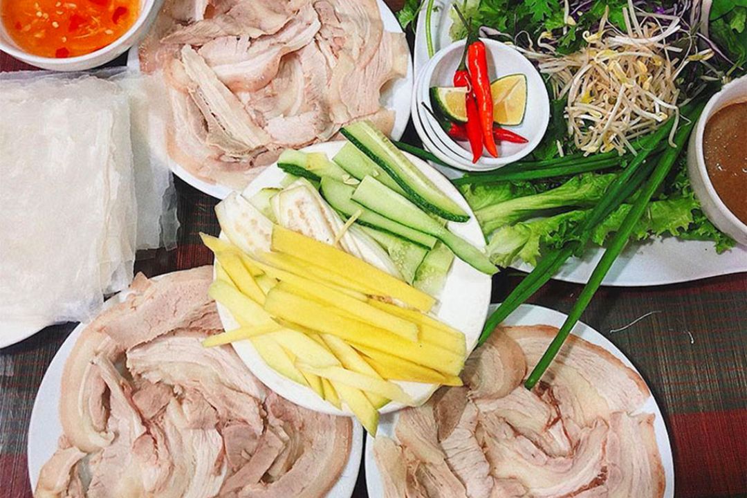 Roll rice paper with pork, famous at Con Market, Da Nang